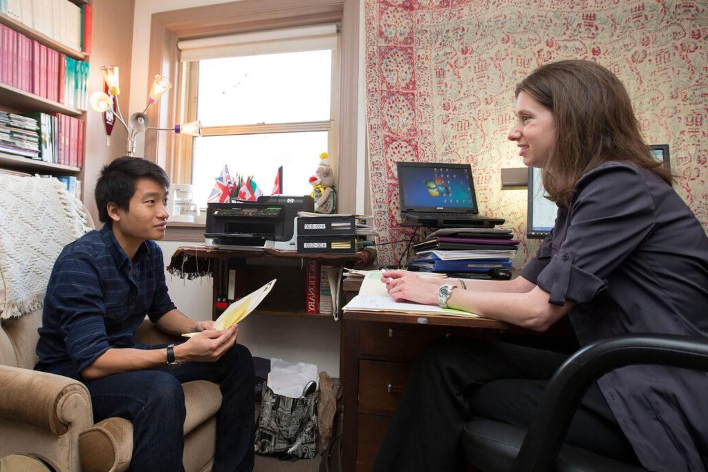 Professor Liz Perry advising a student